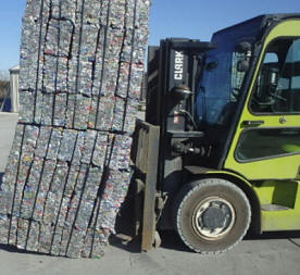 Compacted aluminum scrap metal, being recycled.